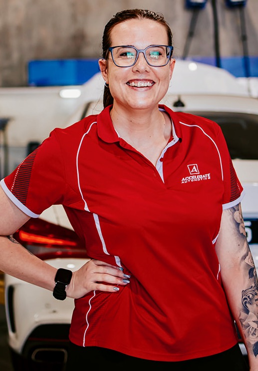 Carl Millward, wearing glasses and a red polo shirt, stands in front of a white car, smiling with one hand on his hip. Carl Millward, wearing glasses and a red polo shirt, stands in front of a white car, smiling with one hand on his hip.